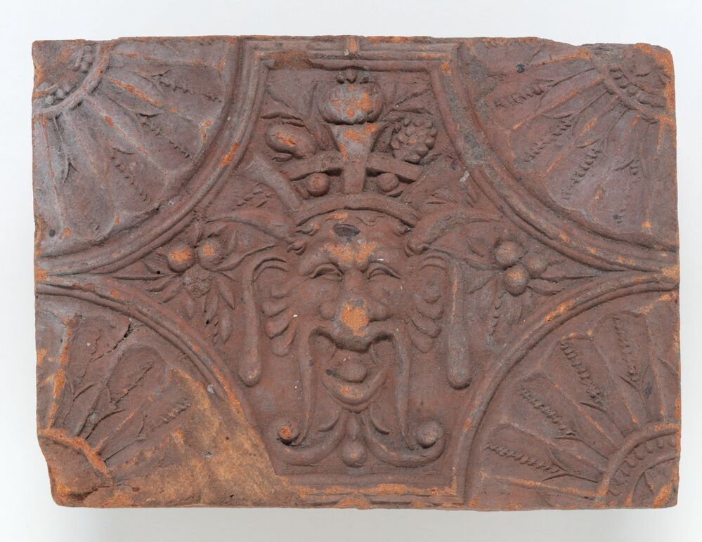 haardsteen met gestileerd leeuwenmasker