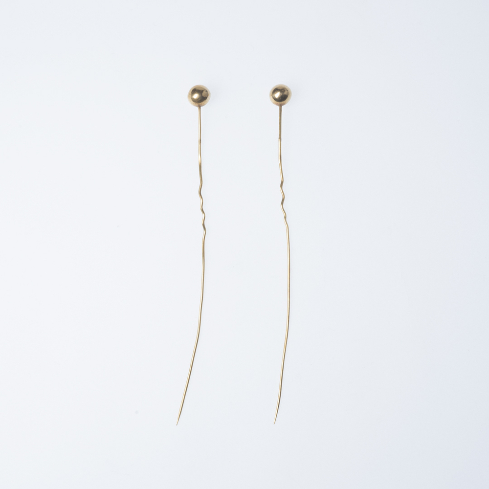 Twee gouden mutsspelden