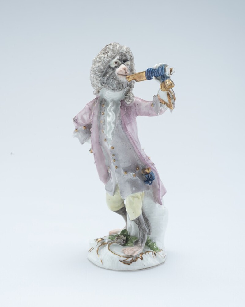 Hoornblazende aap uit het apenorkest