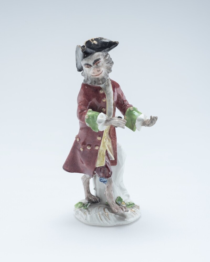 Aap als vioolspeler uit het apenorkest