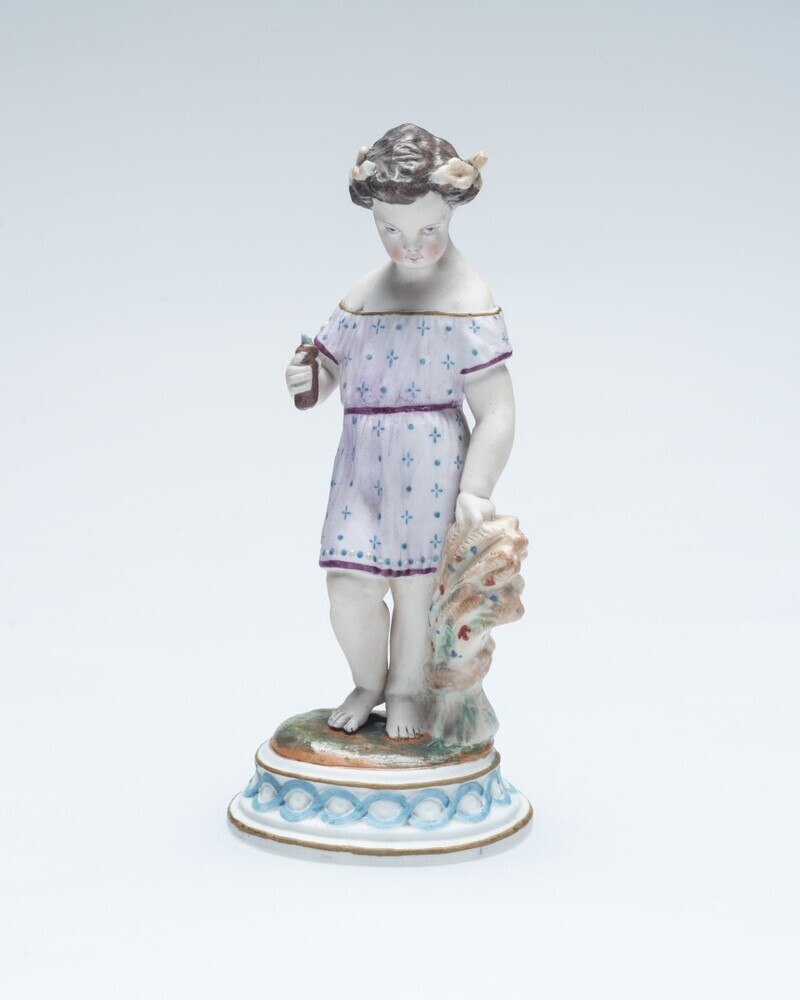 Meisje bij korenschoof