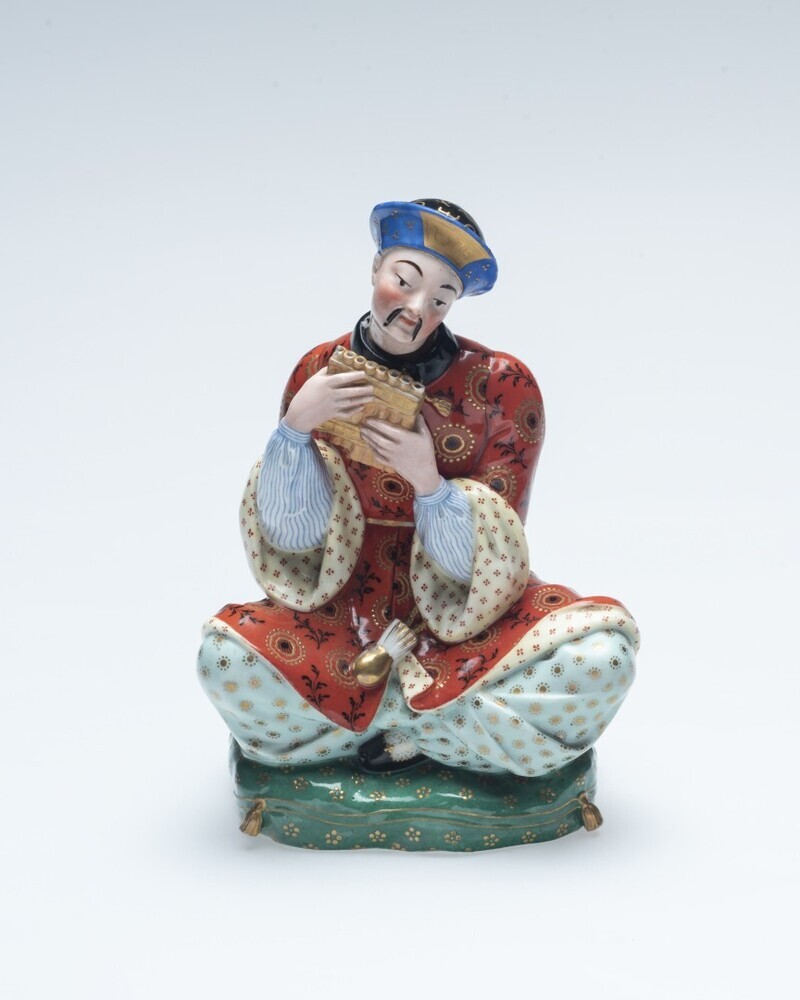 Parfumflesje in de vorm van een zittende Chinese man