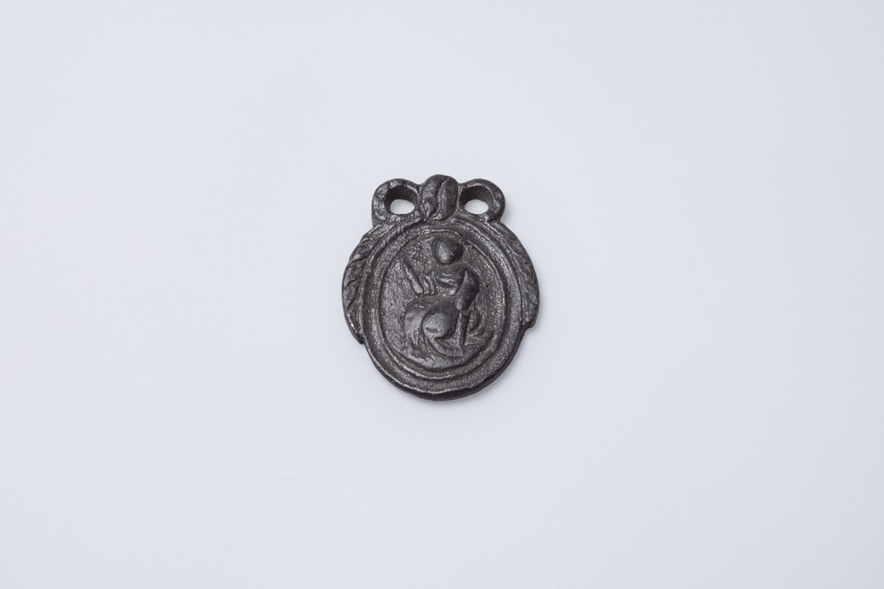 Loden model voor een medaillon