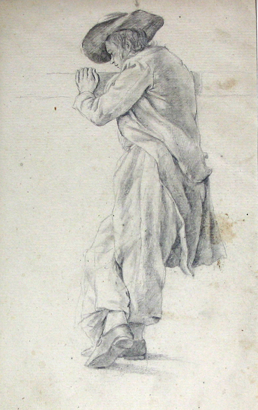 Staande man leunend tegen een balk