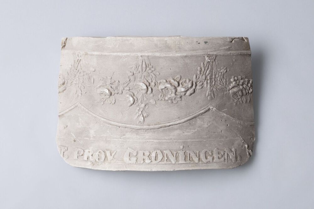 Gipsafgietsel van de klok te Overschild