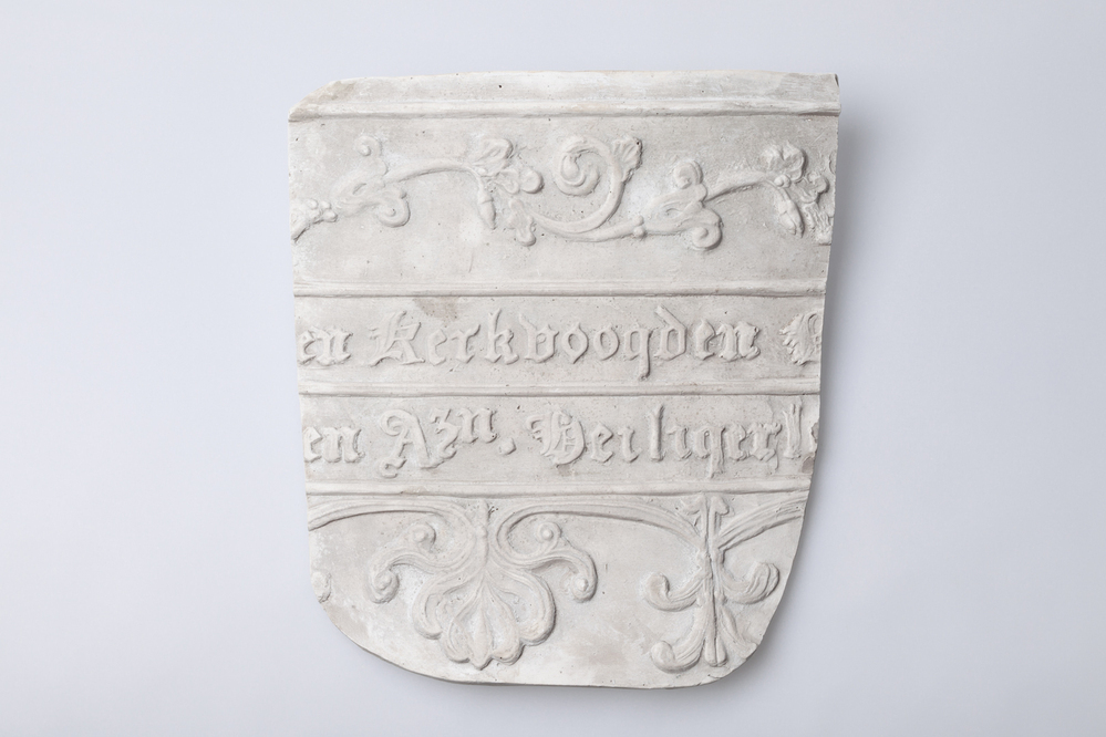 Gipsafgietsel van de klok te Huizinge