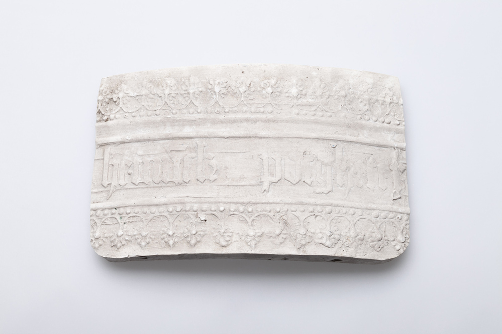 Gipsafgietsel van de klok te Losdorp