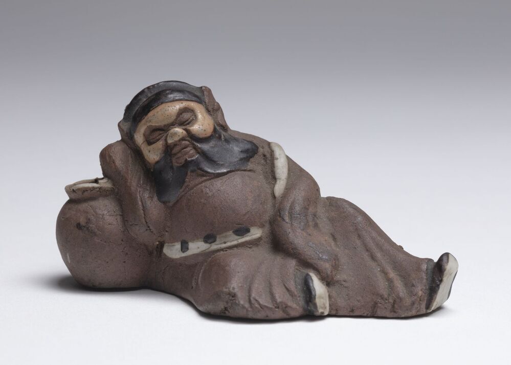 Beeldje van een slapende man