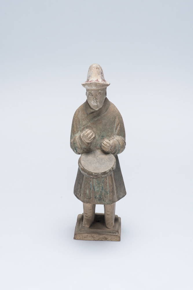 Grafbeeldje van een man met een trommel