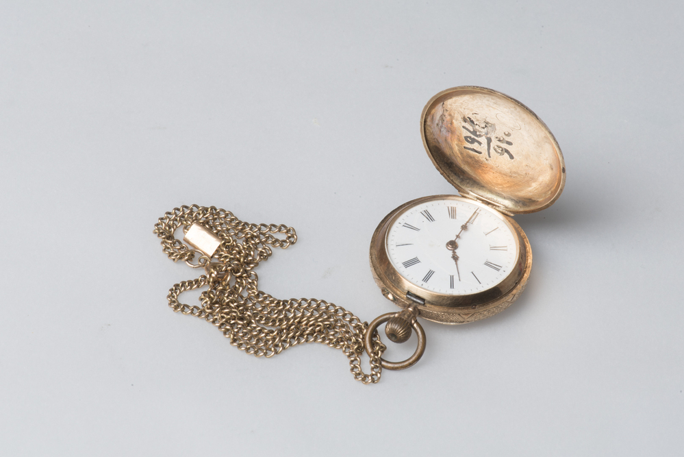 Gouden schakelketting met gouden horloge