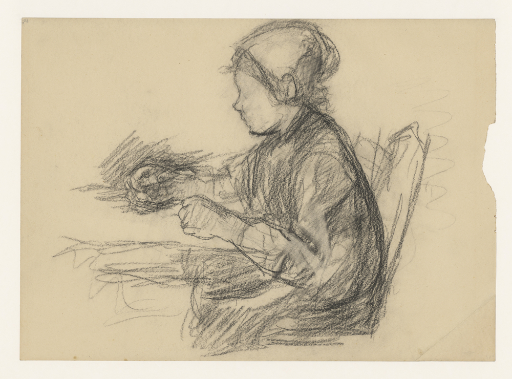 Meisje zittend bij een tafel