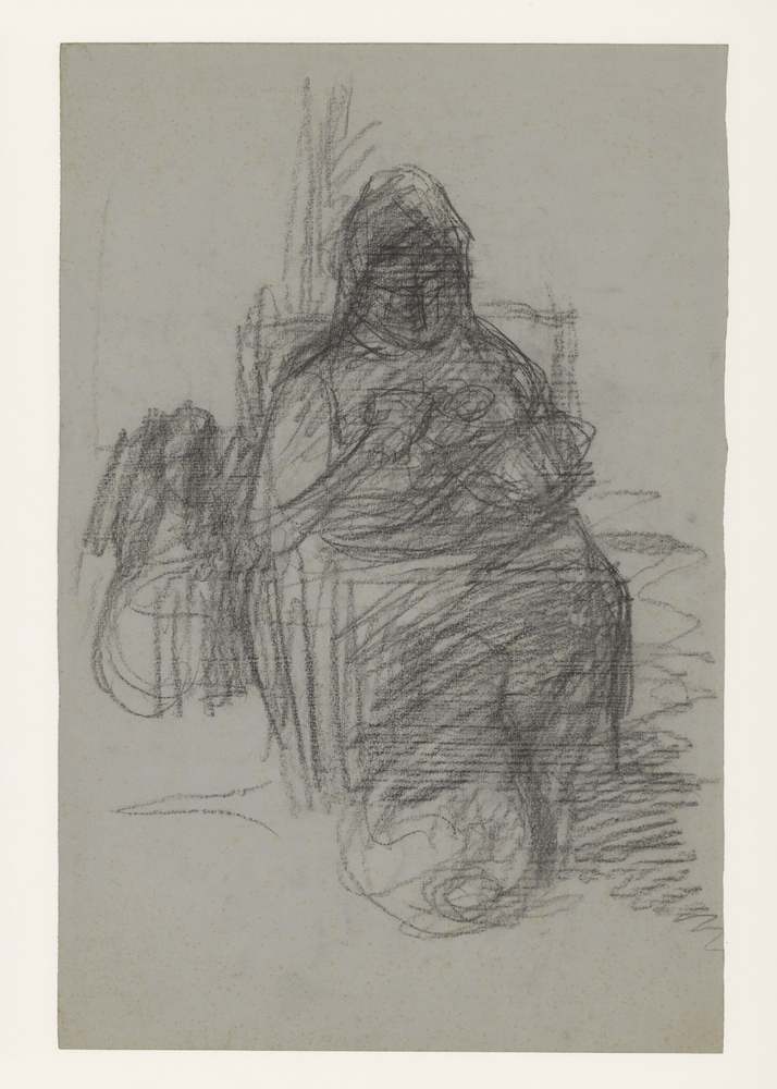 Zittende vrouwfiguur