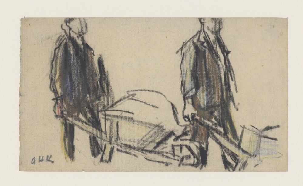 Twee mannen met kruiwagen