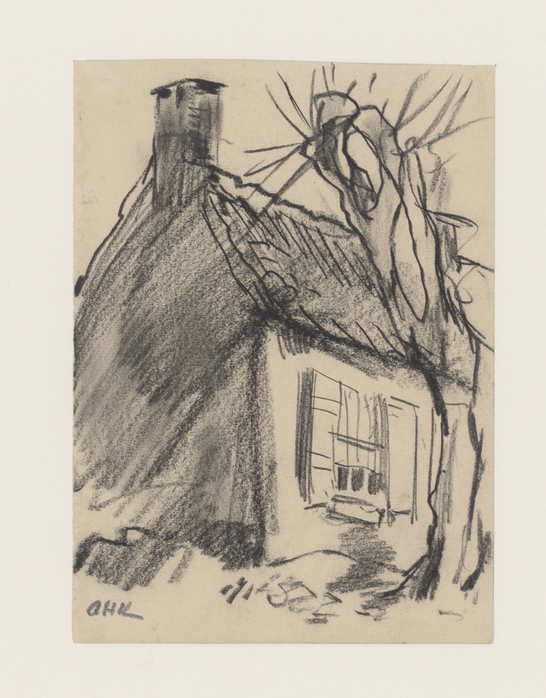 Oud huis onder een boom