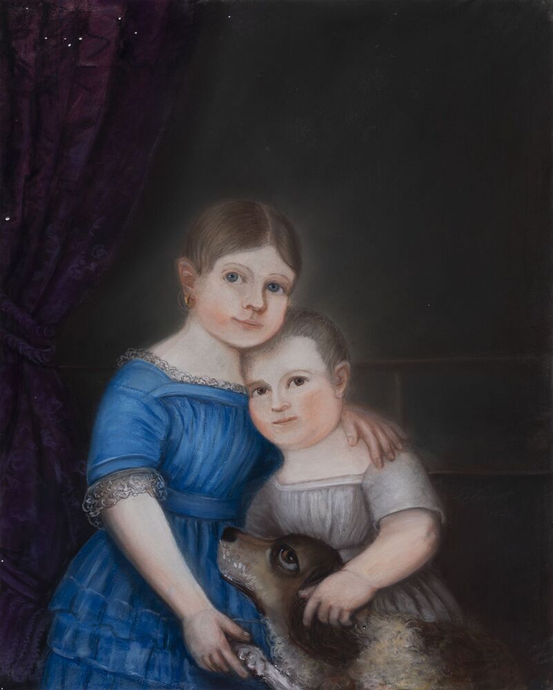 Twee kinderen met een hond