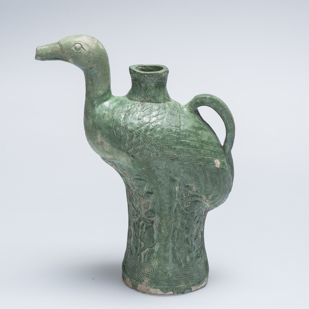 Schenkkan in de vorm van staande kraanvogel