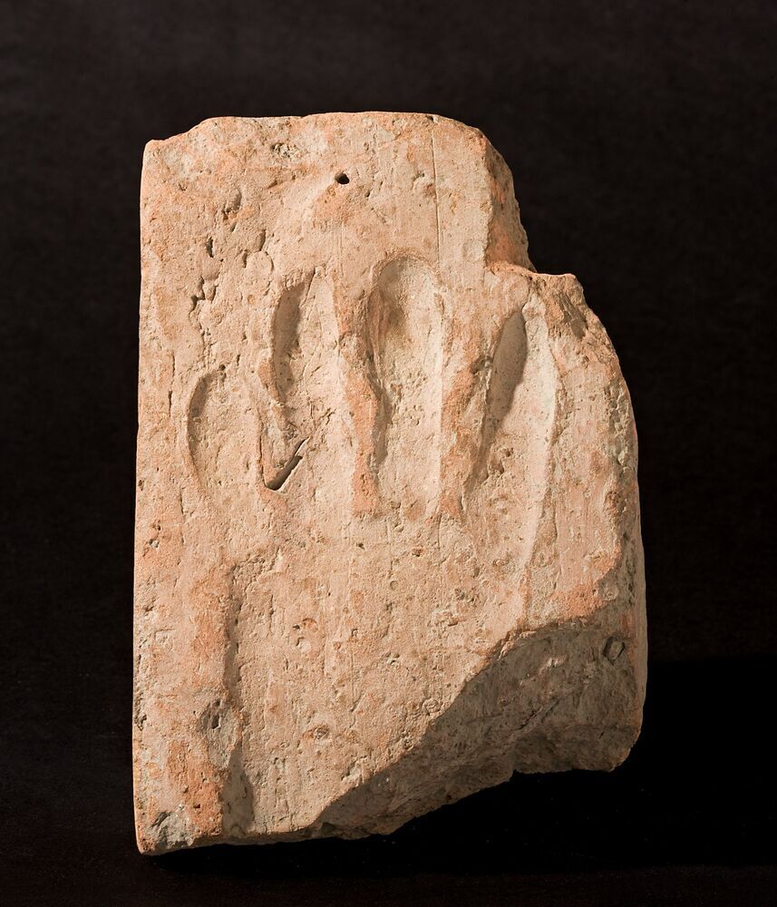 Baksteen met handafdruk