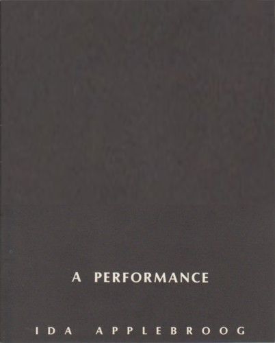 The lifeguards are carrying a still body out of the water.