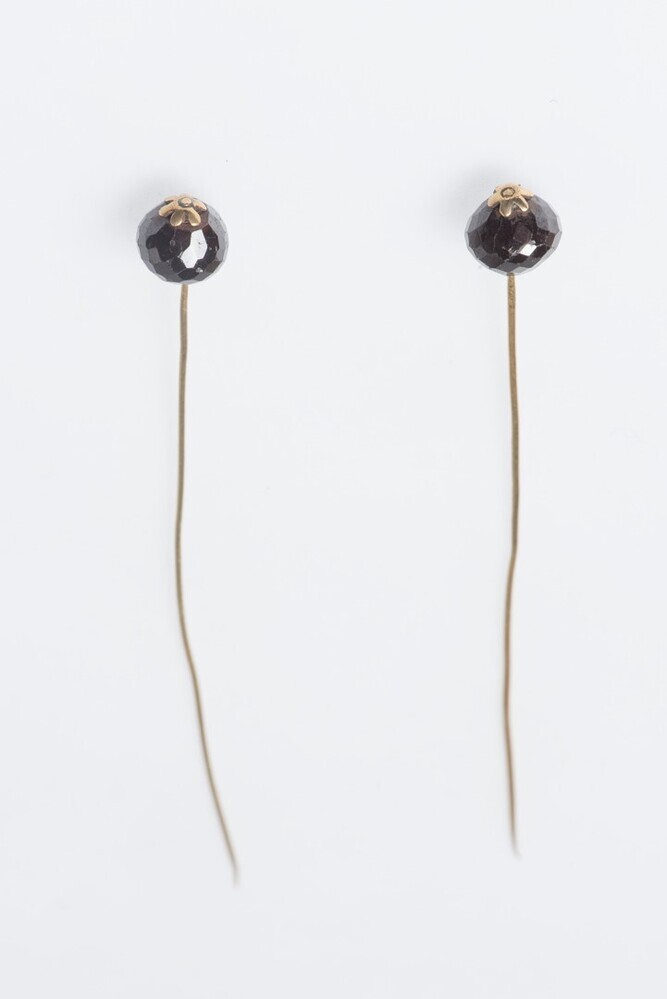 Gouden mutsspelden met granaten