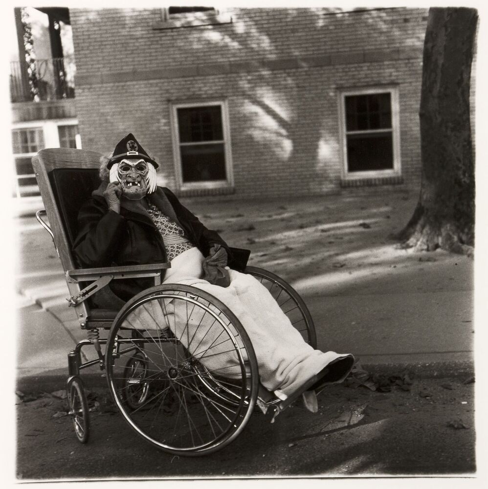 Masked woman in a wheelchair, Pa.