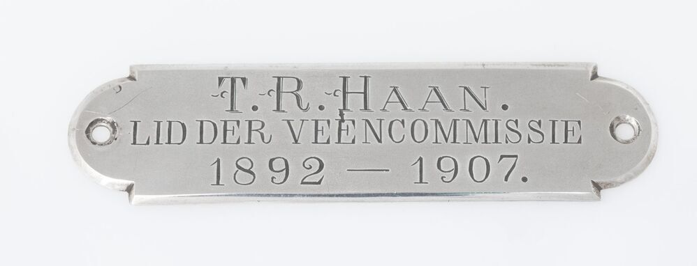 Naamplaat T. R. Haan