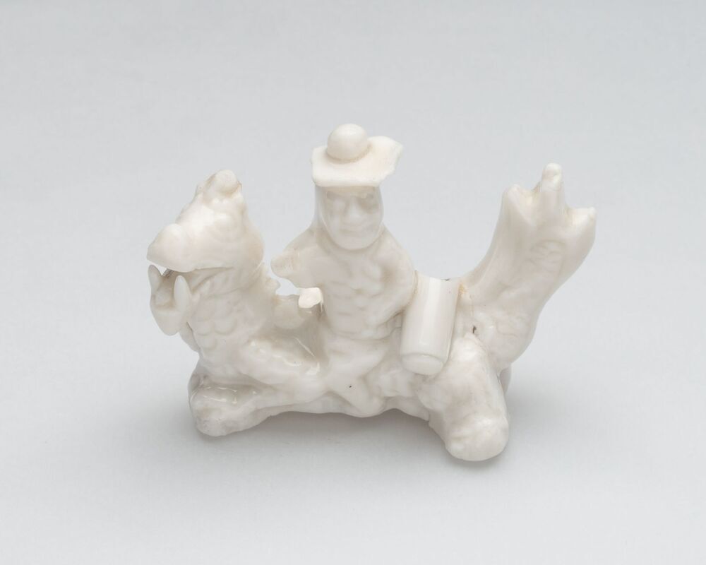 Beeldje van een Europeaan op een qilin