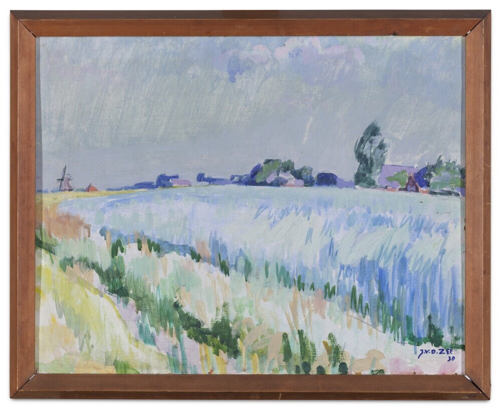 Landschap Groningen met links een molen in de verte