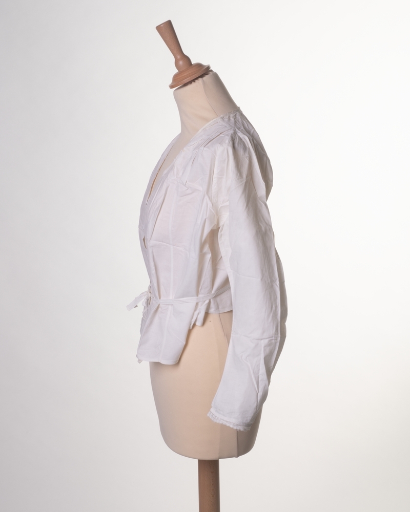 Wit onderlijfje/blouse met lange mouwen